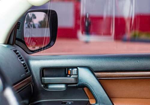 Car leather repair San Diego – restored brown and black leather door panel
