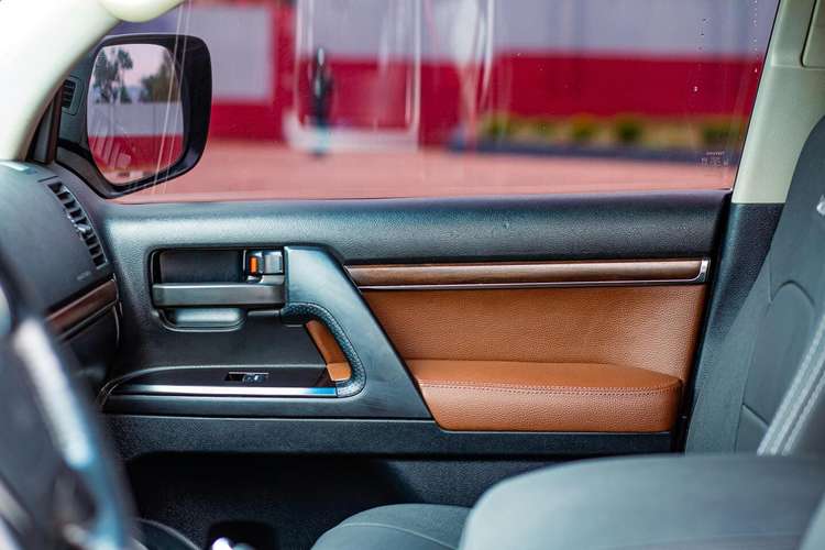 Car leather repair San Diego – restored brown and black leather door panel