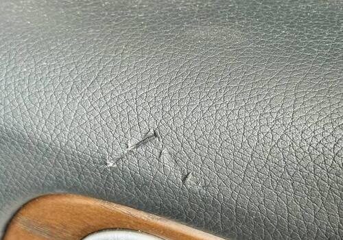 Cracked black leather dashboard panel – Steering Wheel Repair in San Diego
