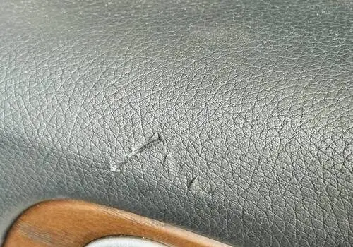 Cracked black leather dashboard panel – Steering Wheel Repair in San Diego