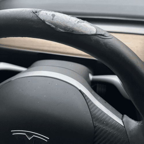 Peeling Tesla Steering Wheel11