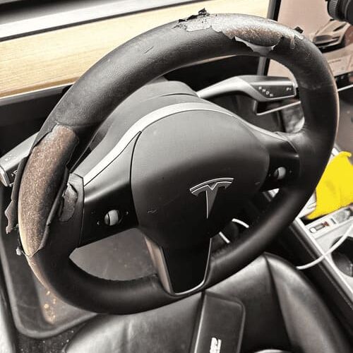 Peeling Tesla Steering Wheels6