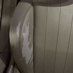 Peeling leather on car seat side bolster before repair